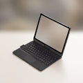 Black iPad keyboard folio case open like a laptop, showing the backlit keyboard and trackpad