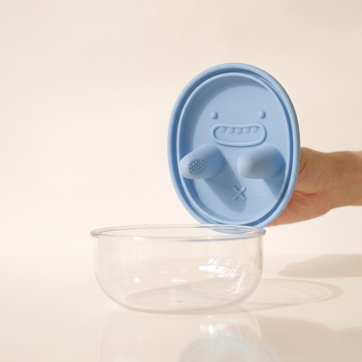 The snack pot with a soft blue silicone lid