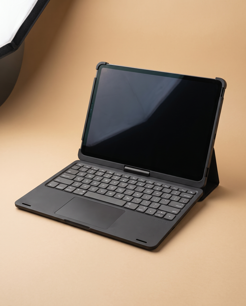 The keyboard case in black, open at a laptop angle with the keyboard and trackpad visible